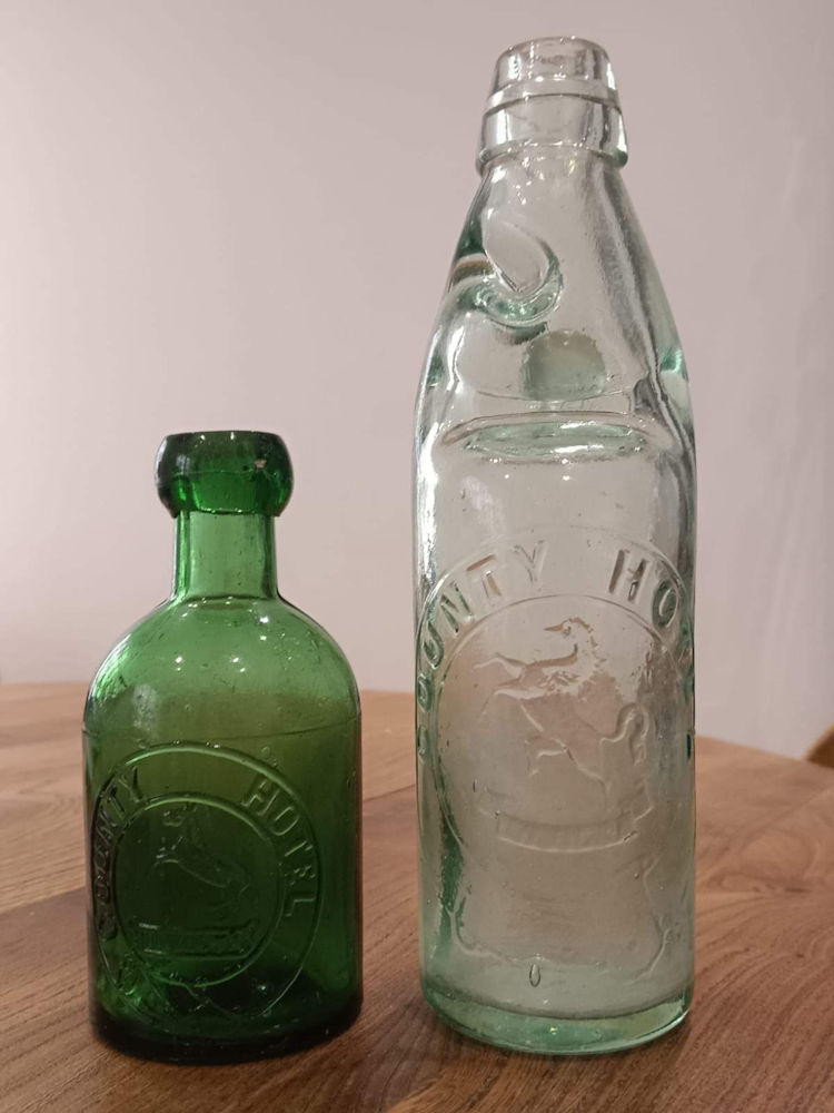 County Hotel bottles