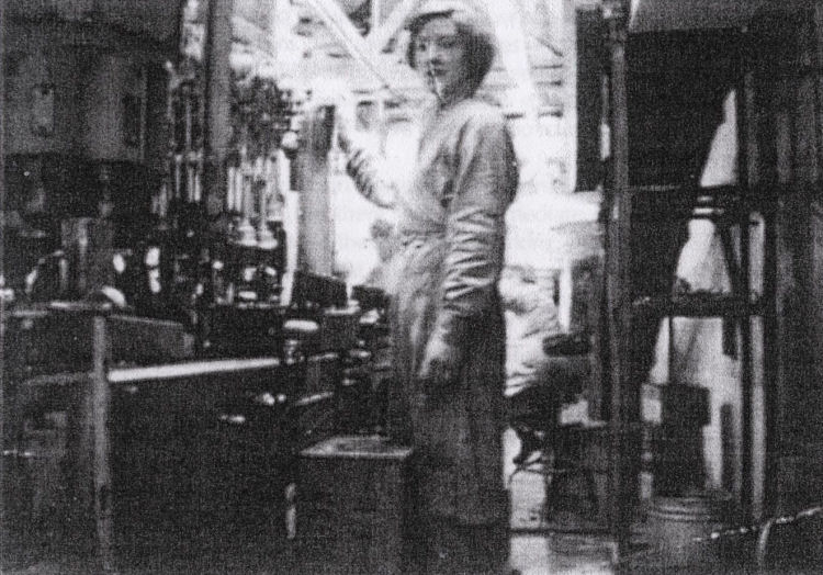 Miss Winifred Delahaye and bottling plant