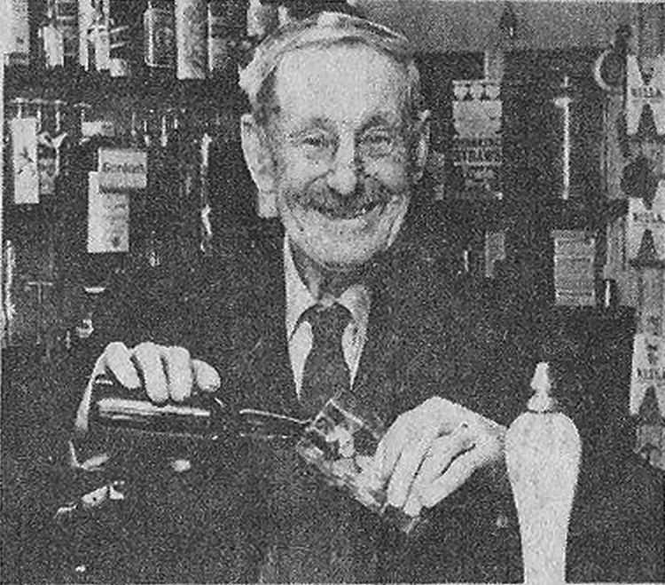 Alfred Jemison behind the bar
